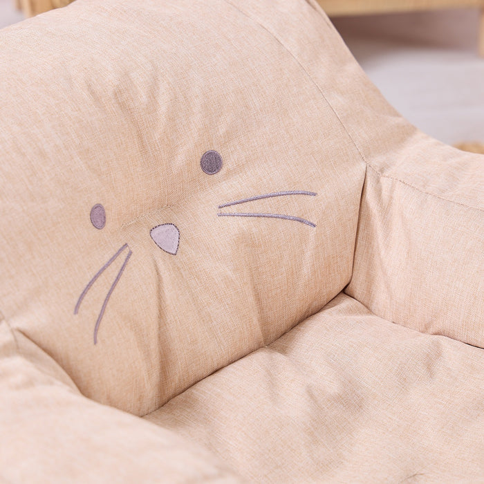 Close-up of the Milo Mouse beanbag chair in soft beige fabric, showing stitched whiskers, button eyes, and nose detail for playful charm