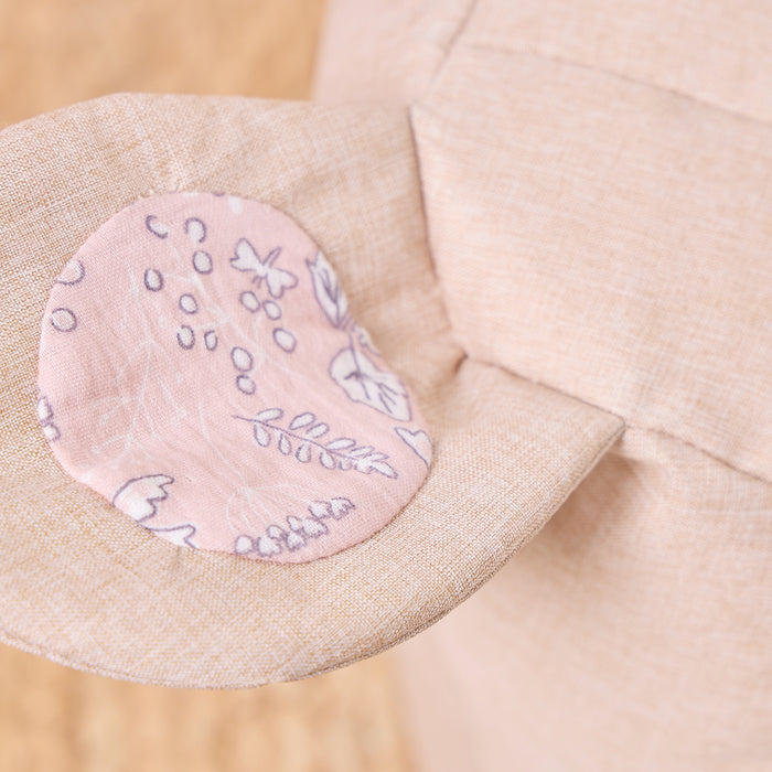Close-up of the Milo Mouse beanbag chair ear with pink floral inner fabric, highlighting stitched details and soft textured material