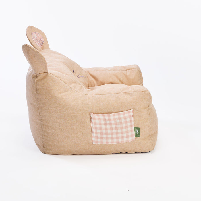 Side cutout of the Milo Mouse beanbag chair in beige fabric with gingham pocket, showing curved armrests and supportive bean-filled seat