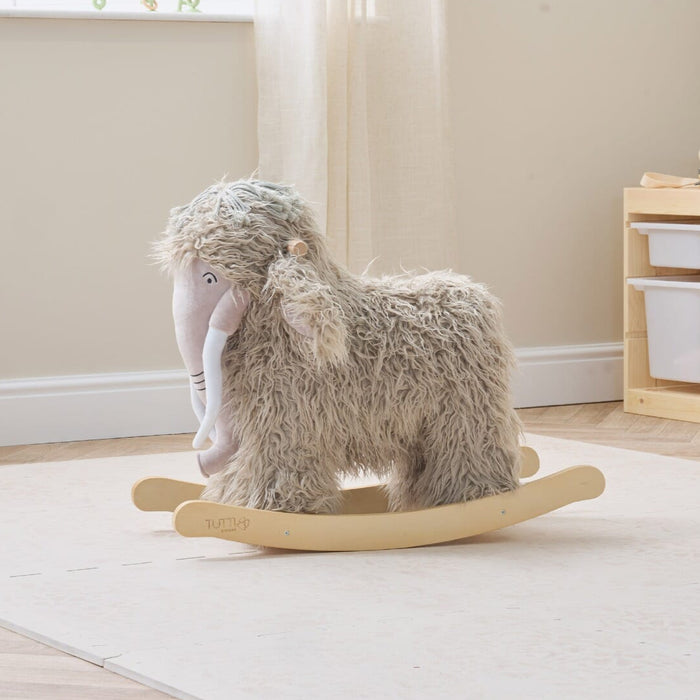 Lifestyle view of Mimi the Mammoth rocking toy styled in a playroom, combining plush comfort with a calm, neutral design