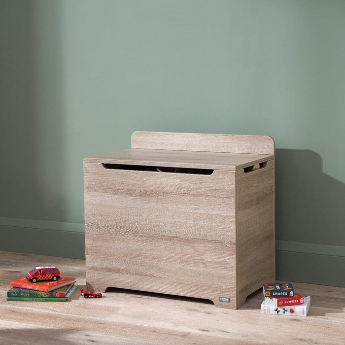 Modena Toy Box Oak styled in a modern nursery room, combining functional toy storage with a clean and natural wood-look aesthetic