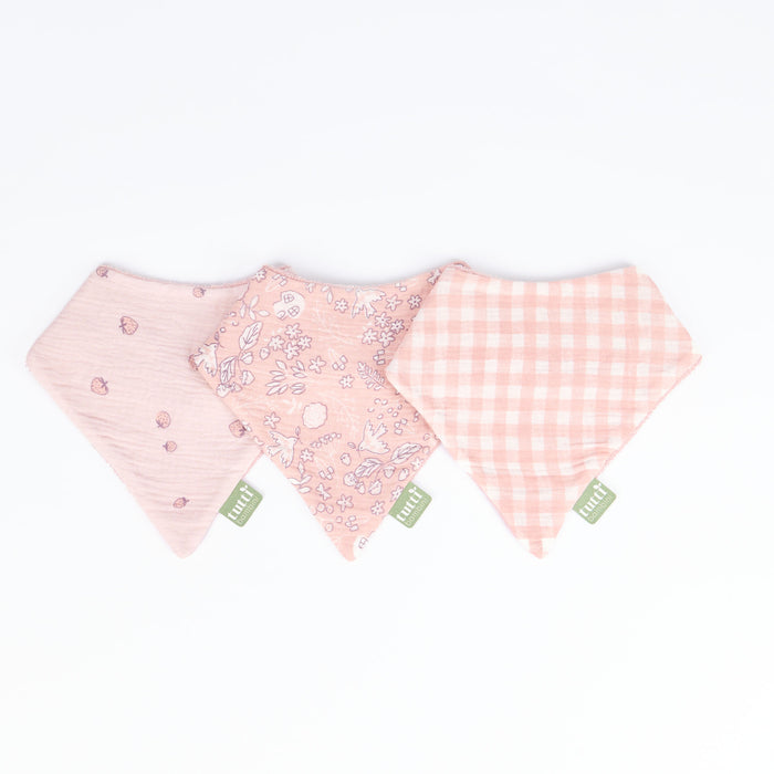 Three pink baby bibs with different patterns of the Tiny Tails collection, on a white background