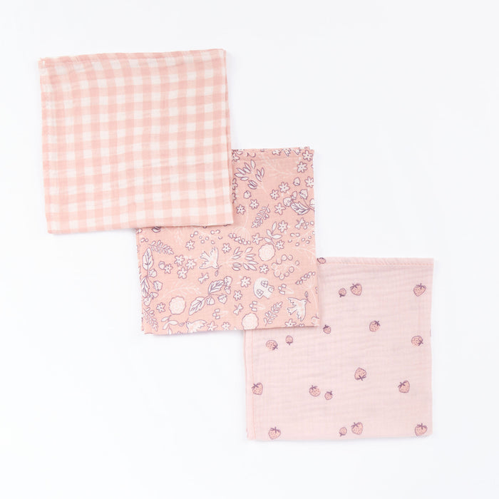 Tiny Tails muslin cloth set in blush gingham, floral woodland and strawberry print, displayed in cutout view to highlight soft cotton finish.
