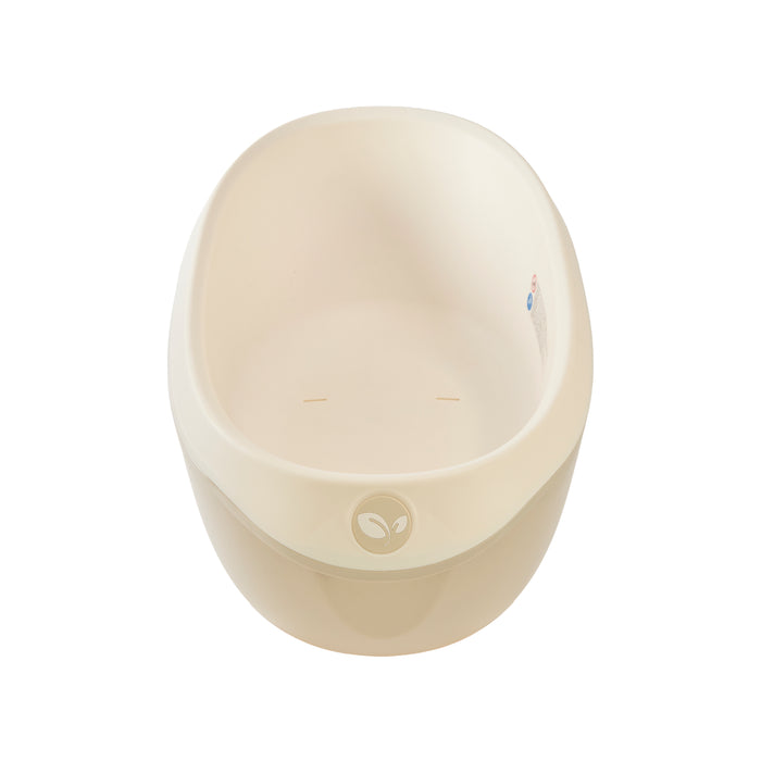 Top view of the Nati Baby Bath in dune, designed to cradle babies securely during bath time