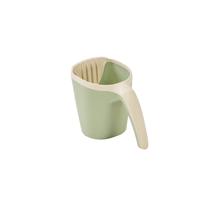 Side view of the Nati bath jug in green, featuring soft curves and an easy-grip design, in a white background