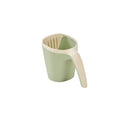 Side view of the Nati bath jug in green, featuring soft curves and an easy-grip design, in a white background