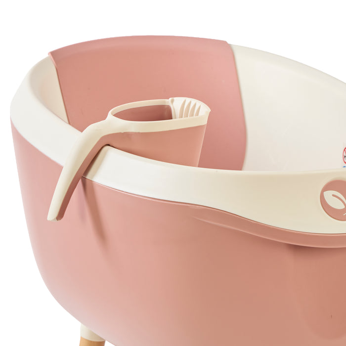 Image of the Nati jug in pink placed neatly within the Nati Baby Bath, showcasing its perfect fit and convenient storage design.