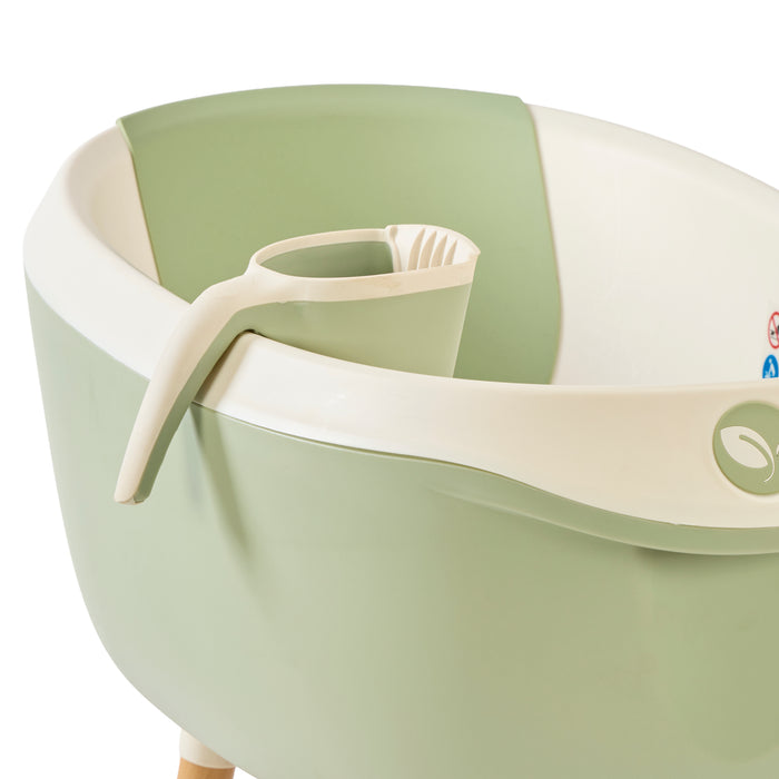 Image of the Nati jug in green placed neatly within the Nati Baby Bath, showcasing its perfect fit and convenient design.