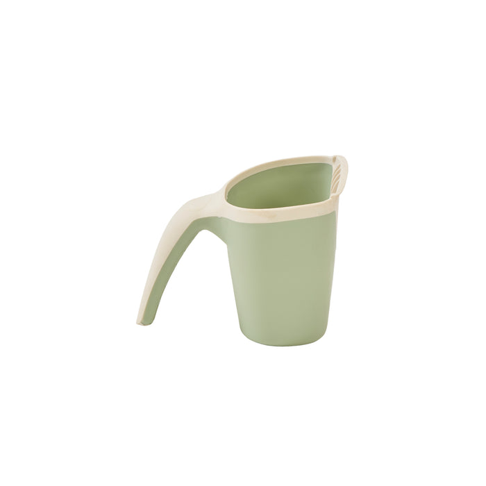 Side view of the Nati bath jug in green, featuring soft curves and an easy-grip design, in a white background