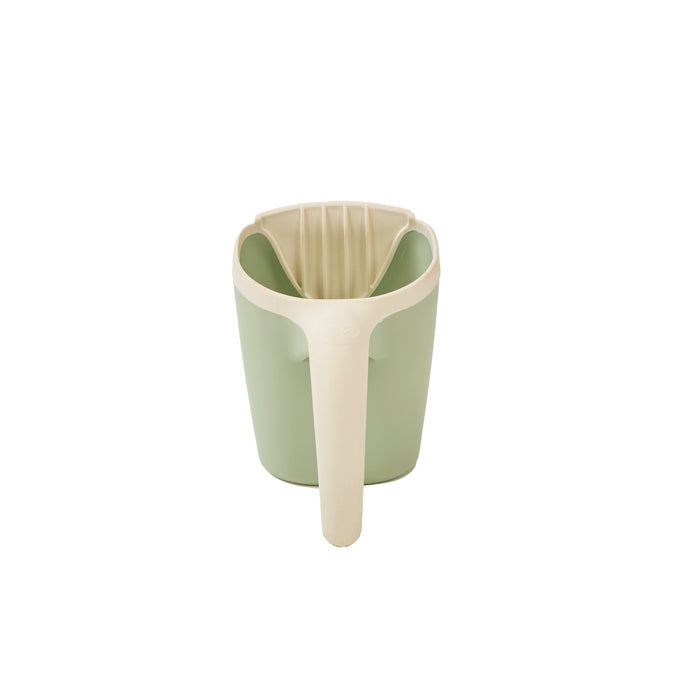 Back view of the Nati bath jug in green, featuring soft curves and an easy-grip design, in a white background