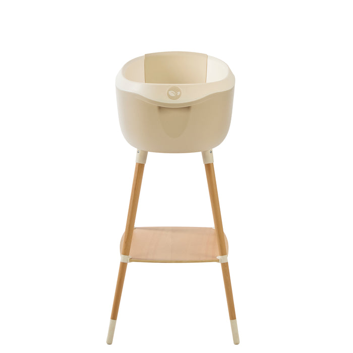 Front view of Nati Baby Bath in dune on wooden stand, in a white background.