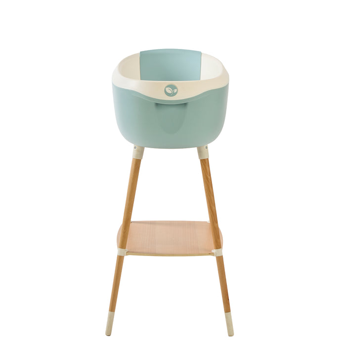 Front view of the Nati Baby Bath in blue on a wooden stand, in a white background.