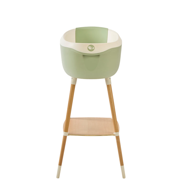 Front view of the Nati Baby Bath in aloe on a wooden stand, in a white background.