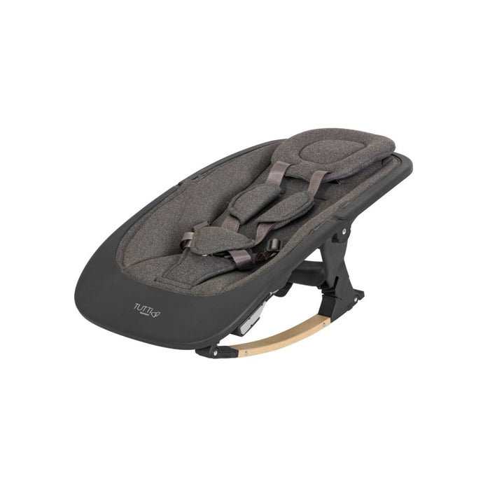 Angled side view of the Nova rocker in Grey and Oak with padded seat insert, harness, and gentle curved legs for soothing motion.