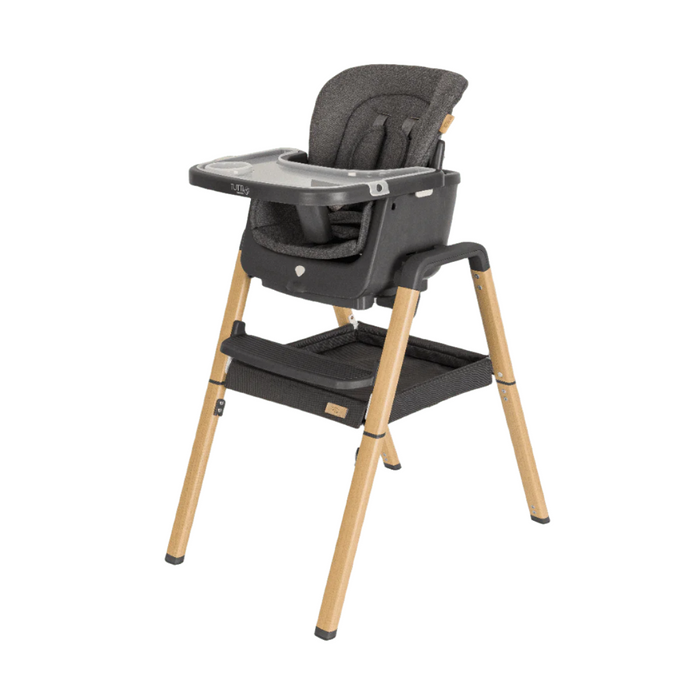 Front angled view of the Nova Evolutionary Highchair in Grey/Oak showing modern design with padded seating, footrest, and integrated tray.