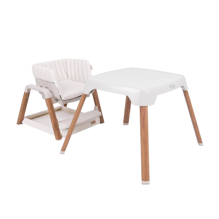 Nova Evolutionary Highchair in Scandinavian Walnut and Ecru shown in toddler chair and play table configuration, highlighting its adaptability for independent play and learning