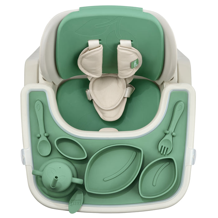 Green accessory baby seat with dining utensils on a white background