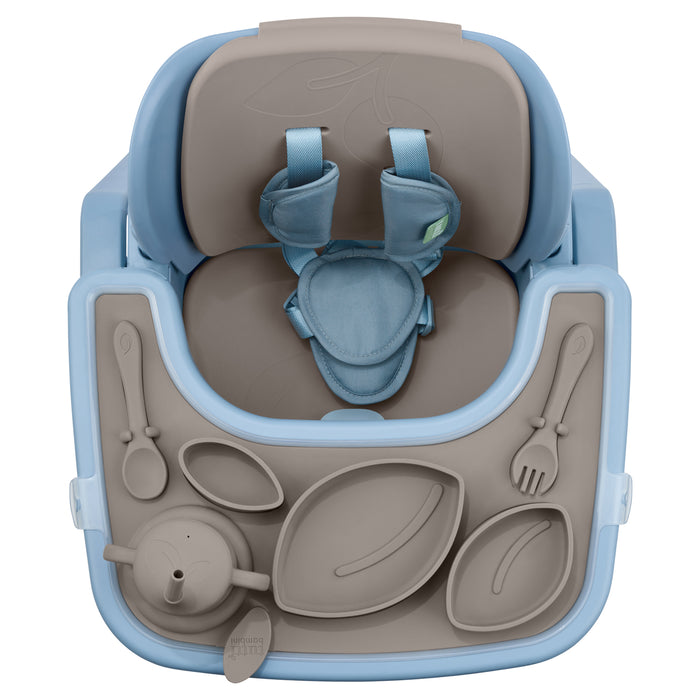 Aerial view of the Nova highchair tray fitted with the cocoa silicone accessory pack, showing compartments for food, cup and cutlery.