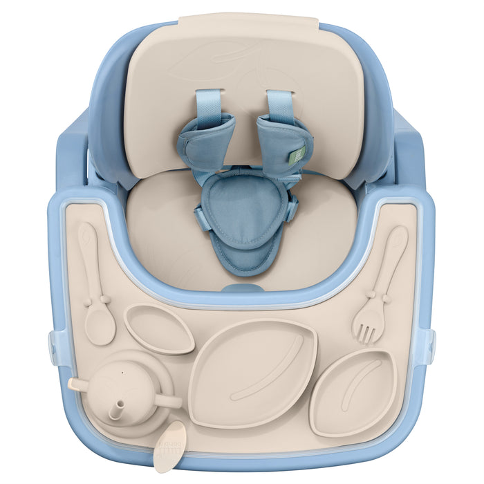 Overhead view of the Nova Maison highchair accessory pack in rusk, highlighting divided silicone plates, bib, cup and tray layout.