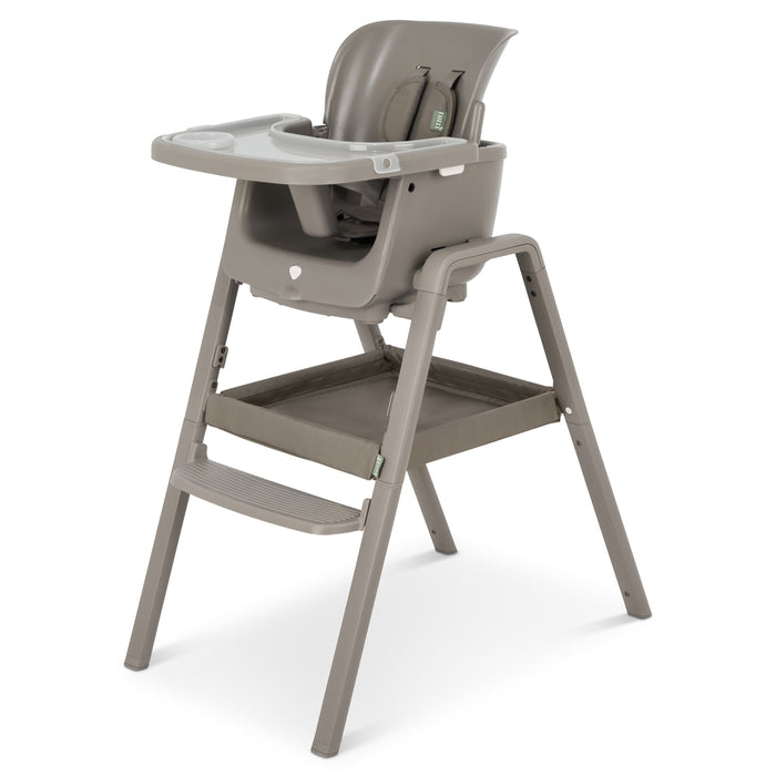 Angled cutout of the nova maison 7 in highchair in truffle, showcasing the  storage tray and versatile feeding setup.