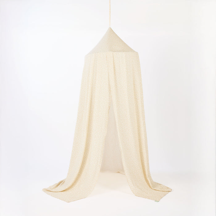 Beige printed canopy over a white background
