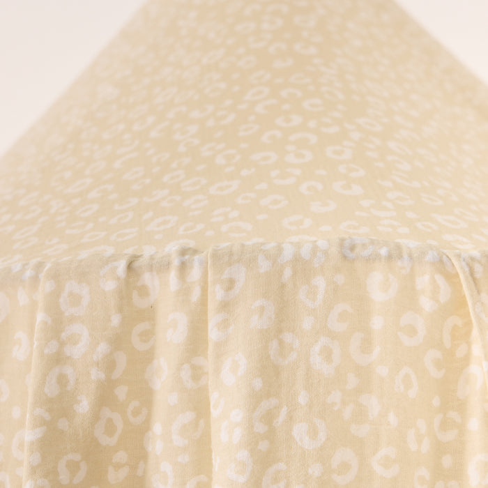 Close-up of beige canopy with subtle pattern