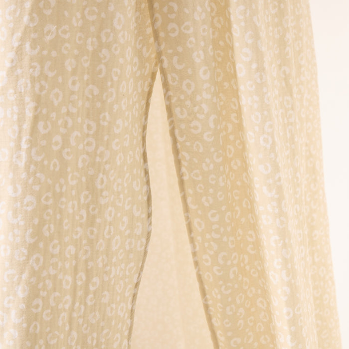 Beige canopy with a subtle pattern on a beige background