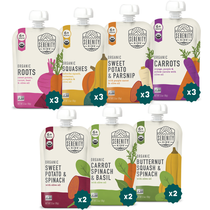 Assorted Serenity Kids organic baby food pouches on a white background