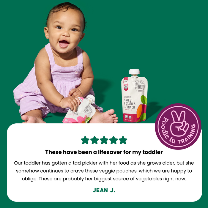 Baby holding a baby food pouch with a green background and text about the product's benefits.