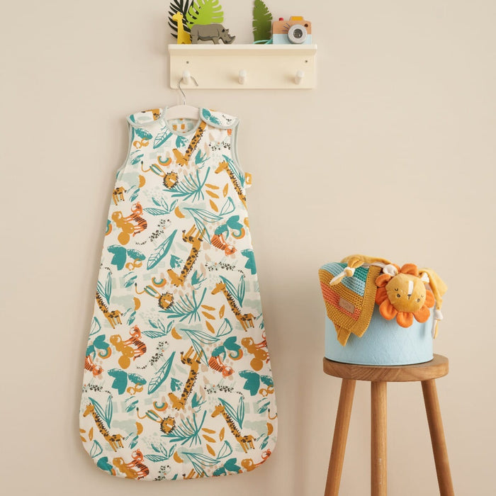 Run Wild baby sleep bag in safari print displayed hanging in a nursery, adding playful colour and practical sleep style