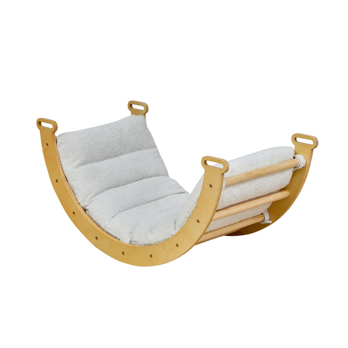 Wooden rocking frame with beige cushion on a white background