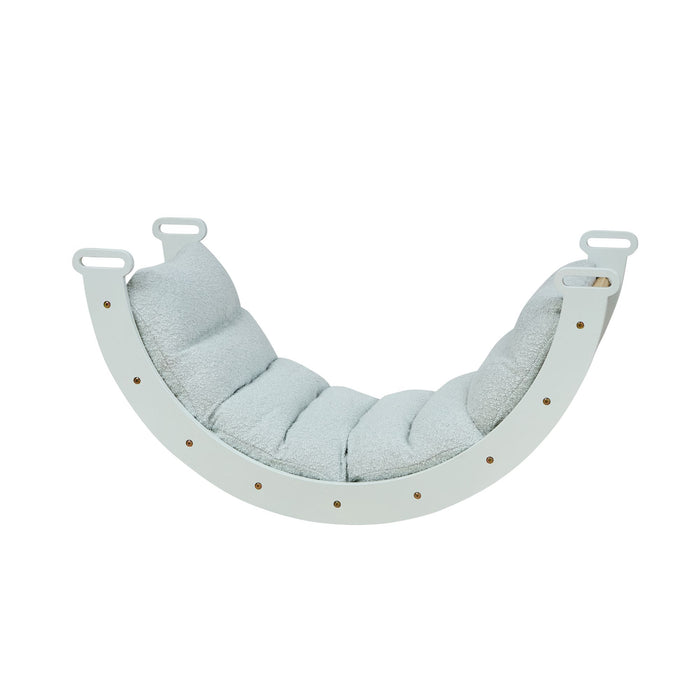 Side cutout of the Scala Montessori Pikler cushion in boucle sea mist, showing its plush textured padding and supportive, full-length cushioning.