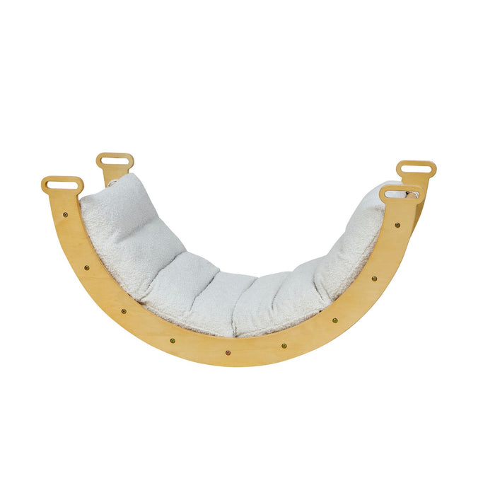 Wooden rocking frame with a beige cushion on a white background