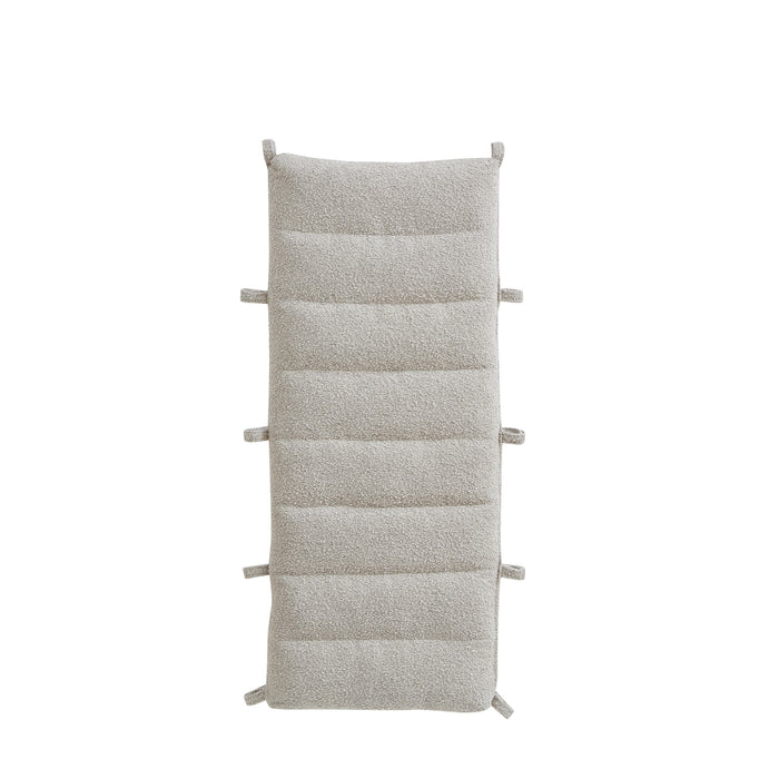 Cutout of the Scala Montessori Pikler Cushion in Boucle Mushroom with looped edges for easy attachment to the rocking frame