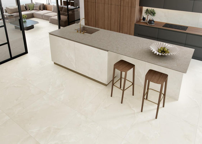 Modern kitchen with a island and bar stools on Soft White 12x24 Matte Porcelain Tile