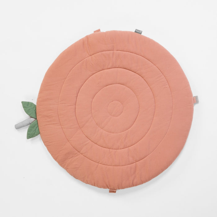 Overhead view of Soft Muslin Padded Playmat in apple with quilted concentric circles and stitched leaf detail.