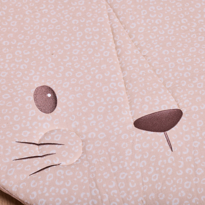 Close-up of Larry Leopard padded playmat showing embroidered eyes, whiskers and soft neutral leopard print fabric.