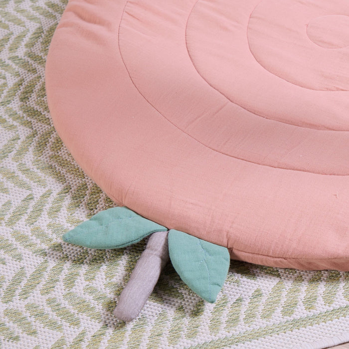 Close-up of Soft Muslin Padded Playmat in apple with quilted circular stitching and soft leaf detail.