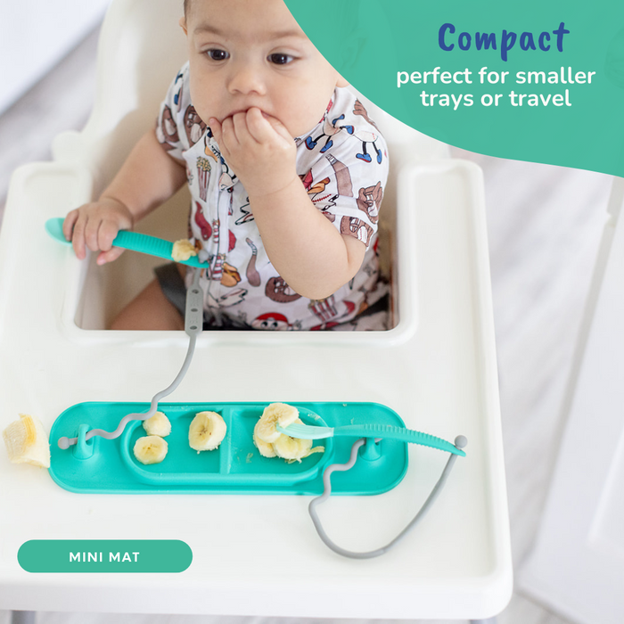 baby eating from busy baby mini suction placemat