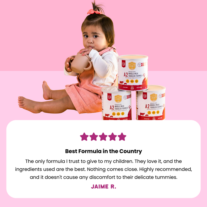Child with A2 toddler formula on a pink background