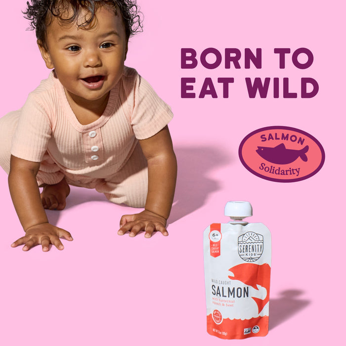 Baby crawling on a pink background with a salmon pouch and 'Born to Eat Wild' text.