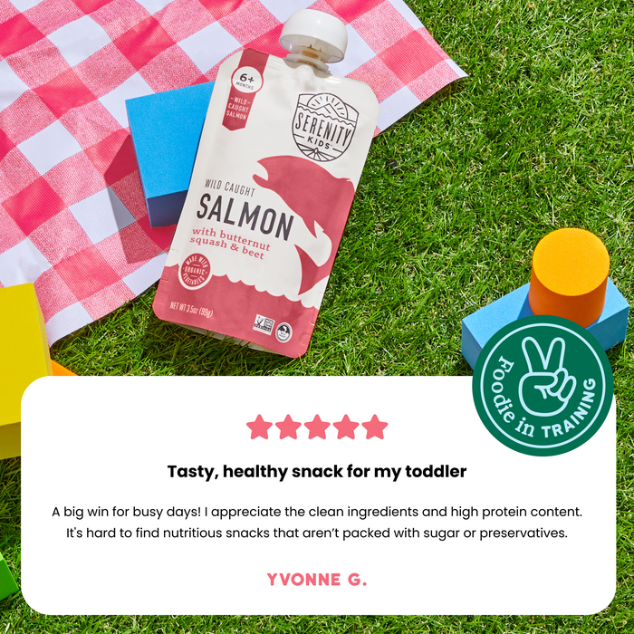 Salmon pouch on a checkered blanket with a peace sign icon and review text.