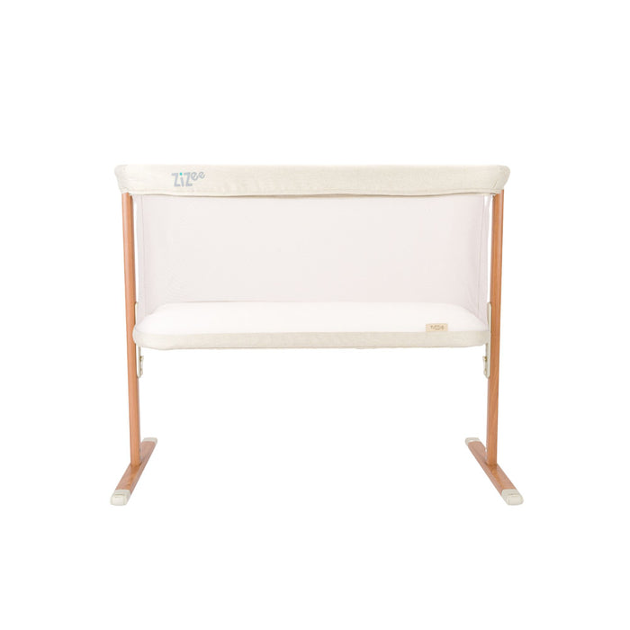 White crib with wooden frame on a white background